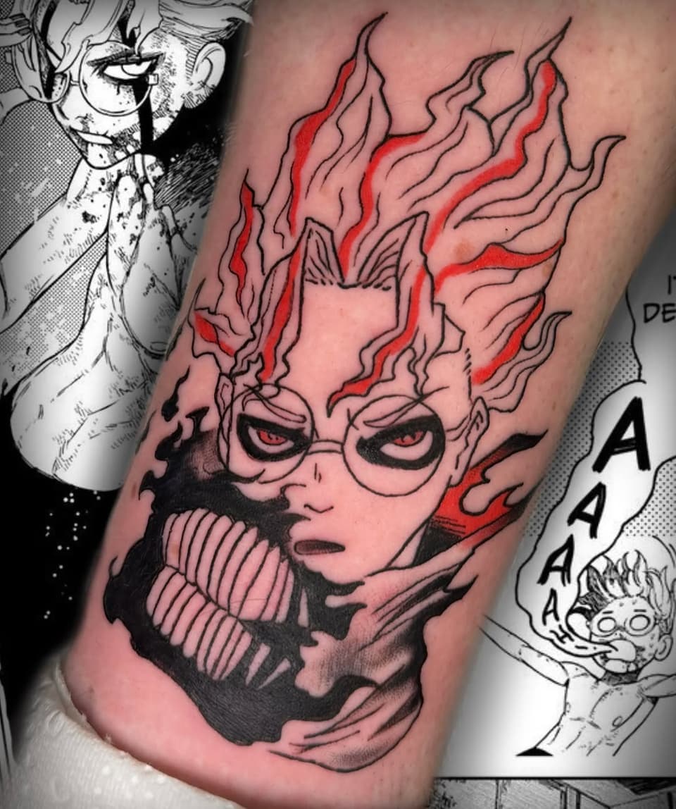 Tattoo featuring a character with glasses, spiky hair with red flames, textured jaw area, and intense expression, displayed on arm with reference artwork.